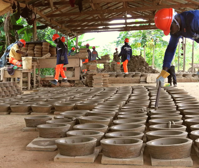 Lady with cookstove | The Core Carbon Project will distribute improved energy efficiency cookstoves to families in rural villages in India. Read more about this innovative project.